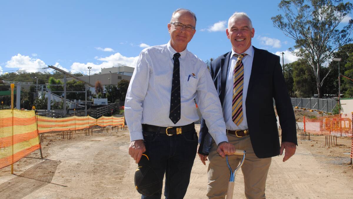 John Dee director John Hart and chief executive officer Warren Stiff at the site of the abattoir's new regional cold storage facility. 
