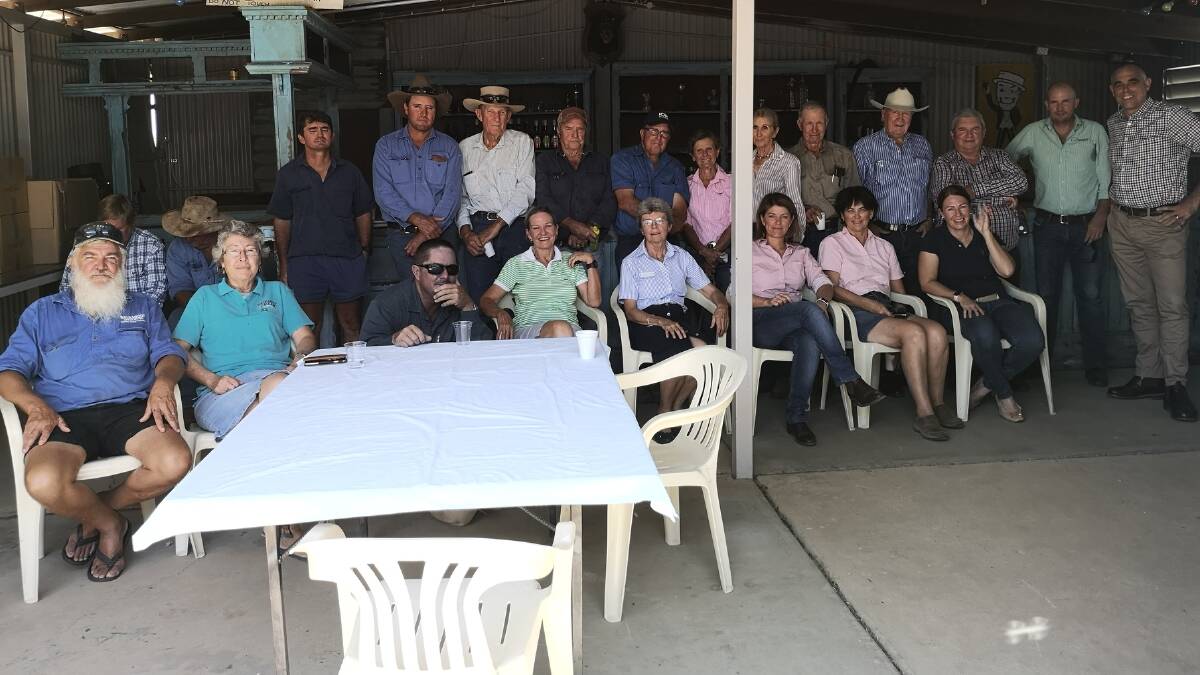 Attendees at a community meeting held by Mr Stone (third left standing) at the McKinlay Walkabout Creek Hotel.