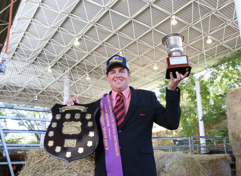 HONOUR: Brent Williams is on top of the world after winning the young auctioneers trophy at the royal Queensland Show. Photo: Jocelyn Garcia