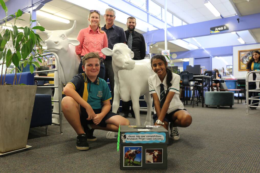 BIGGER AND BETTER: Teachers Laura Perkins, Edward Stocker and Vincent Kurger and students Jay Limbrick and Jasleen Kaur with two Archibulls and the competition box to name a bull. Photo: Jocelyn Garcia