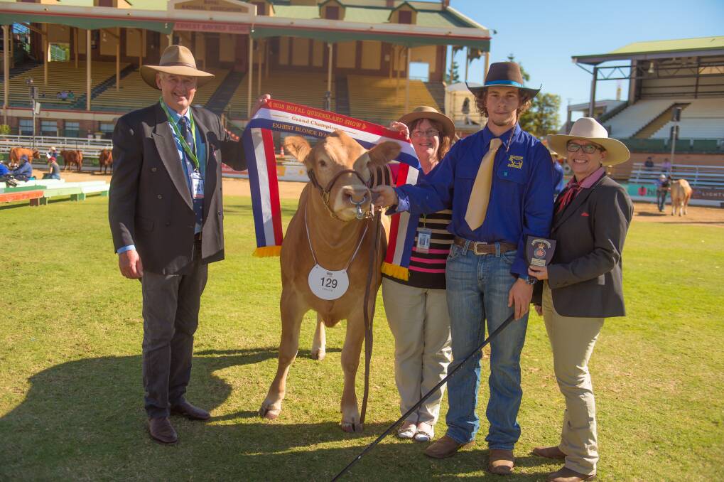 Judge Peter Collins, Tennyson, with steward Elizabeth Creagh, Lisa Hedges, Elders Stud Stock, Toowoomba, and Luke Aisthorpe, Monto, with the grand champion exhibit.