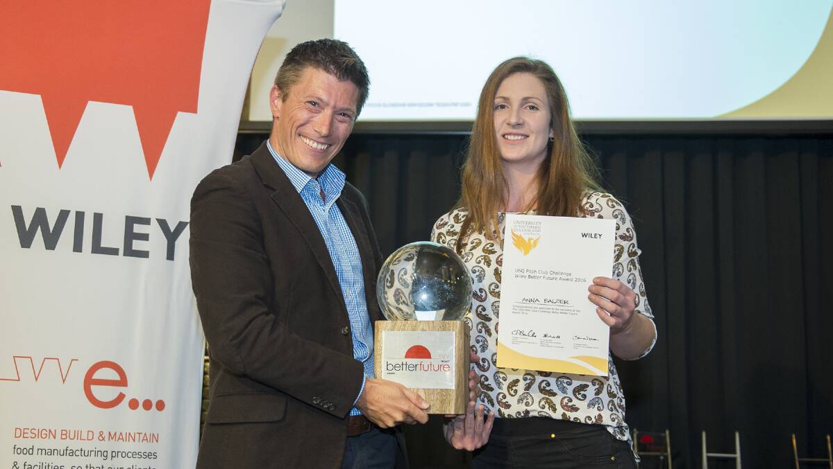 PhD student winner Anna Balzer and Wiley Innovation and Strategy Director Brandon Miller presenting the Wiley Better Future Award trophy. Photo: University of Southern Queensland