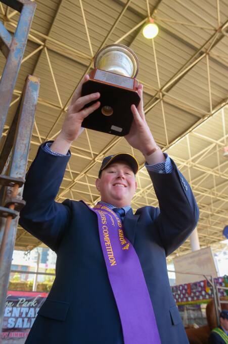 Big win: Nick Shorten, GDL, Roma, took home the hotly contested champion ribbon and trophy at today's ALPA Queensland young auctioneers competition. 