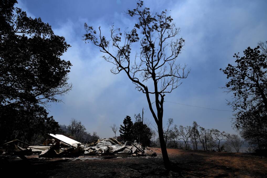 The burnt remains of a house destroyed by a bushfire at Kabra. Photo: AAP