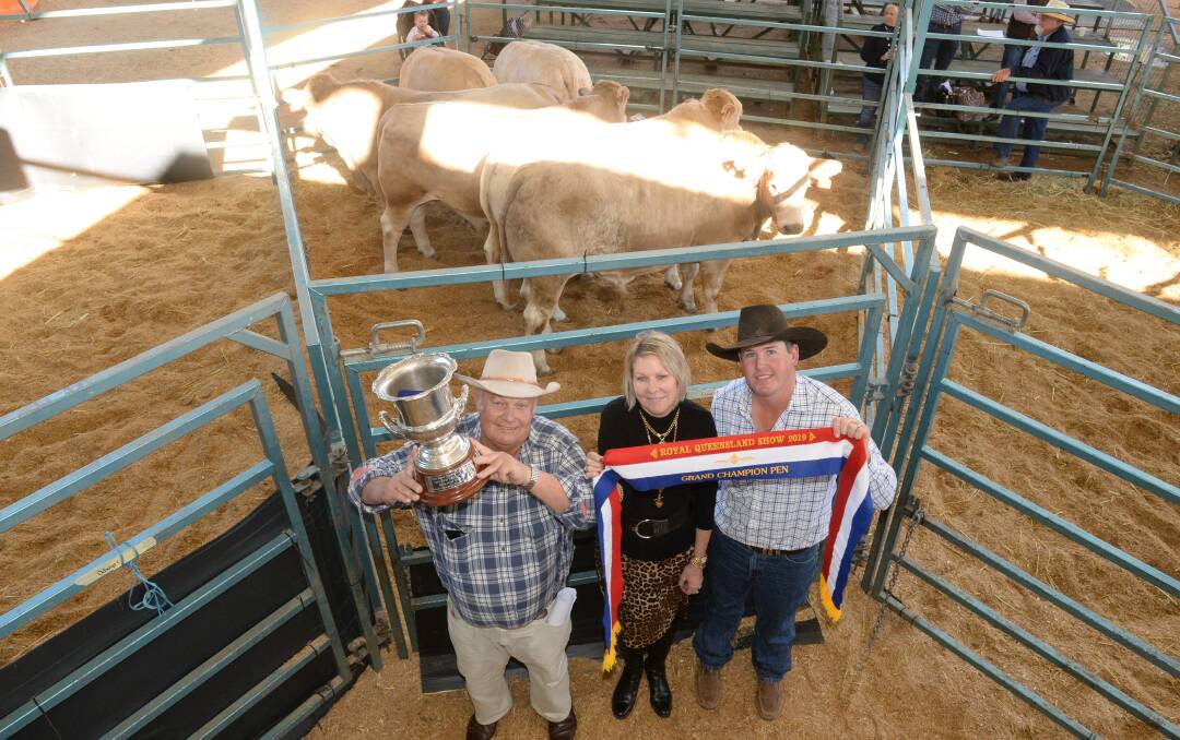Noel and Liz Cook with Ben Fogg, Kindon, Goondiwindi, in front of the Queensland Country Life grand champion pen of Charolais steers.
