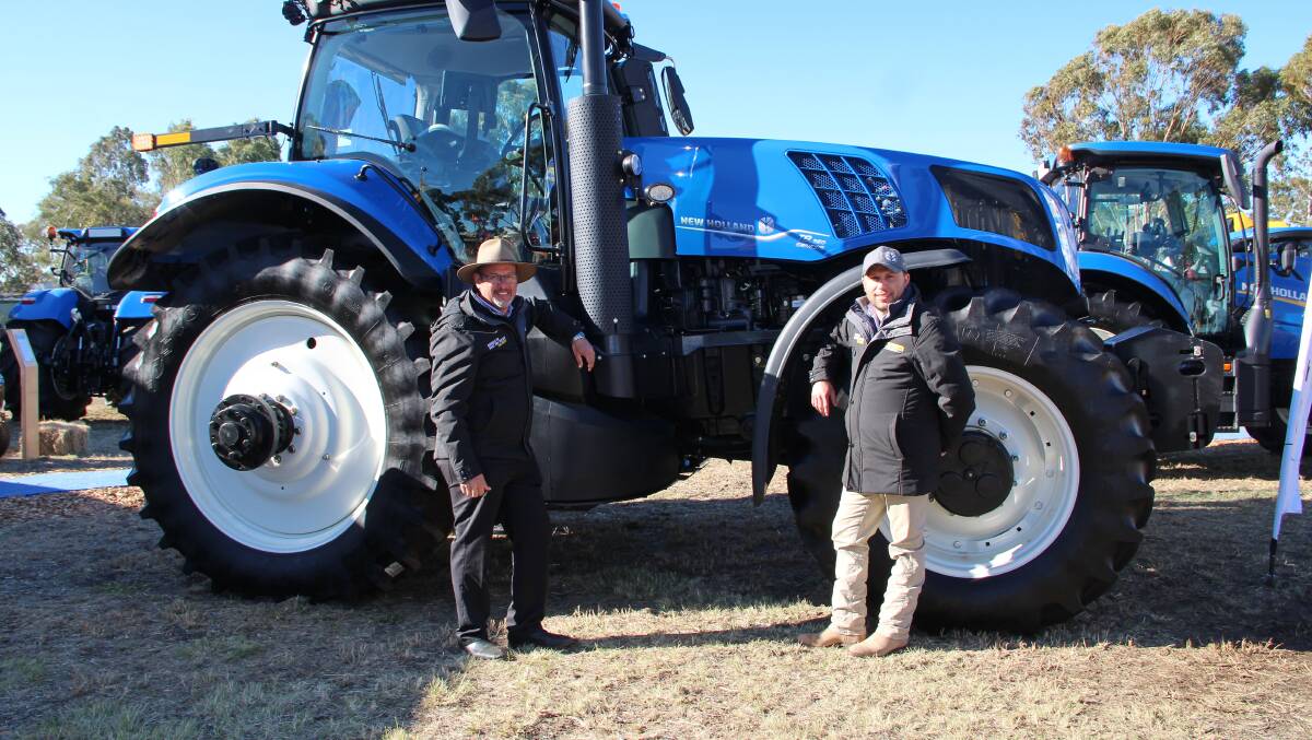 New Holland Agriculture and Construction North Queensland business sales manager Damian Worth and Precision Land Management Australia and New Zealand product segment manager Chris Camilleri with the New Holland T8.350 Genesis tractor. 