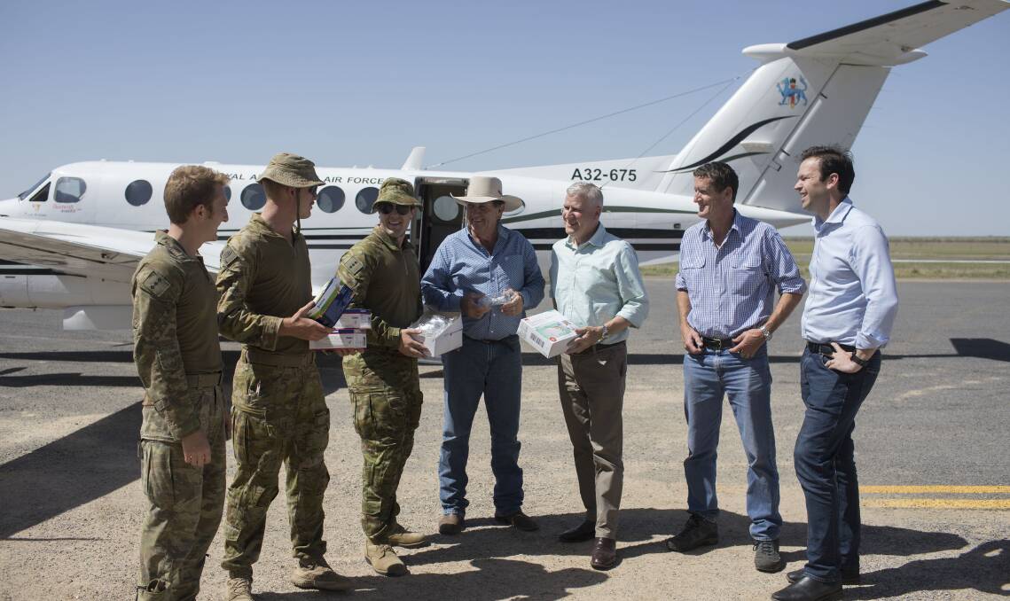 Australian Defence Force personnel on the ground in Quensland with Richmond Shire Mayor John Wharton, Deputy PM Michael McCormack, LNP Candidate for Kennedy Frank Beveridge and Resources Minister Matt Canavan.