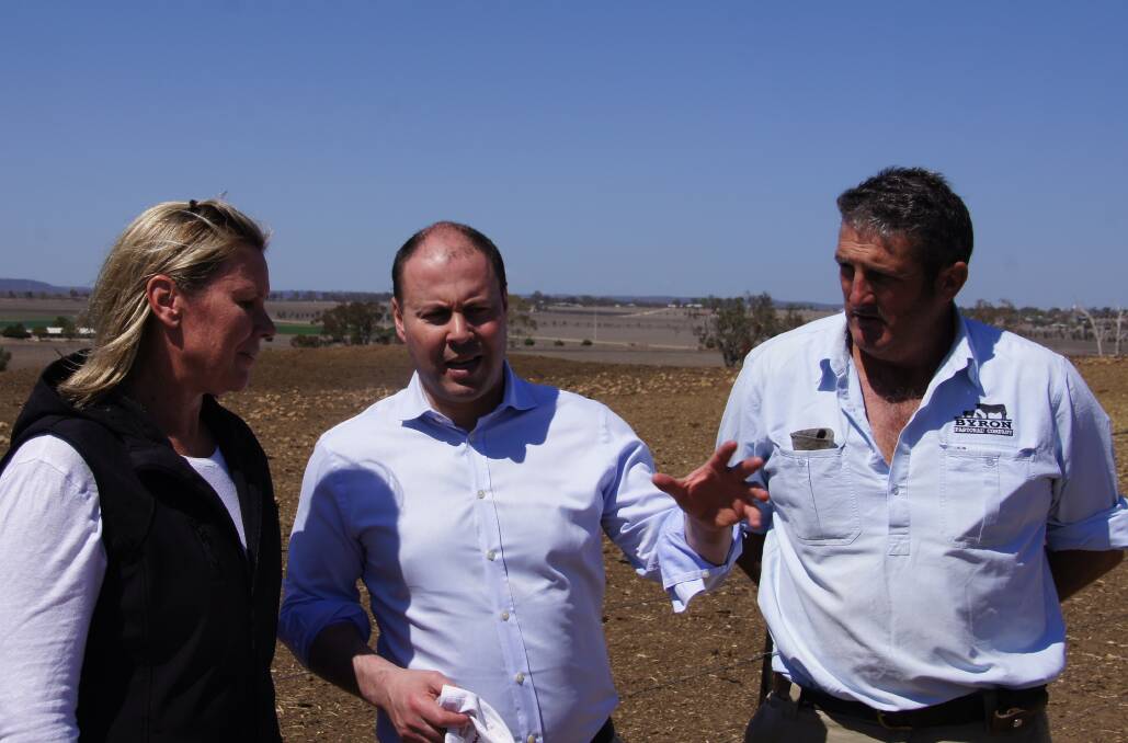 Treasurer Josh Frydenberg with Sandy and Ben Swan at their property near Inverell, in northern NSW.