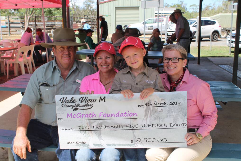 Buyer, Brian Thompson, Topline Droughtmasters, Mt Urah, Colleen and Mac Smith, Vale View M stud and Lisa Hedges, Elders, with the $2500 charity cheque.