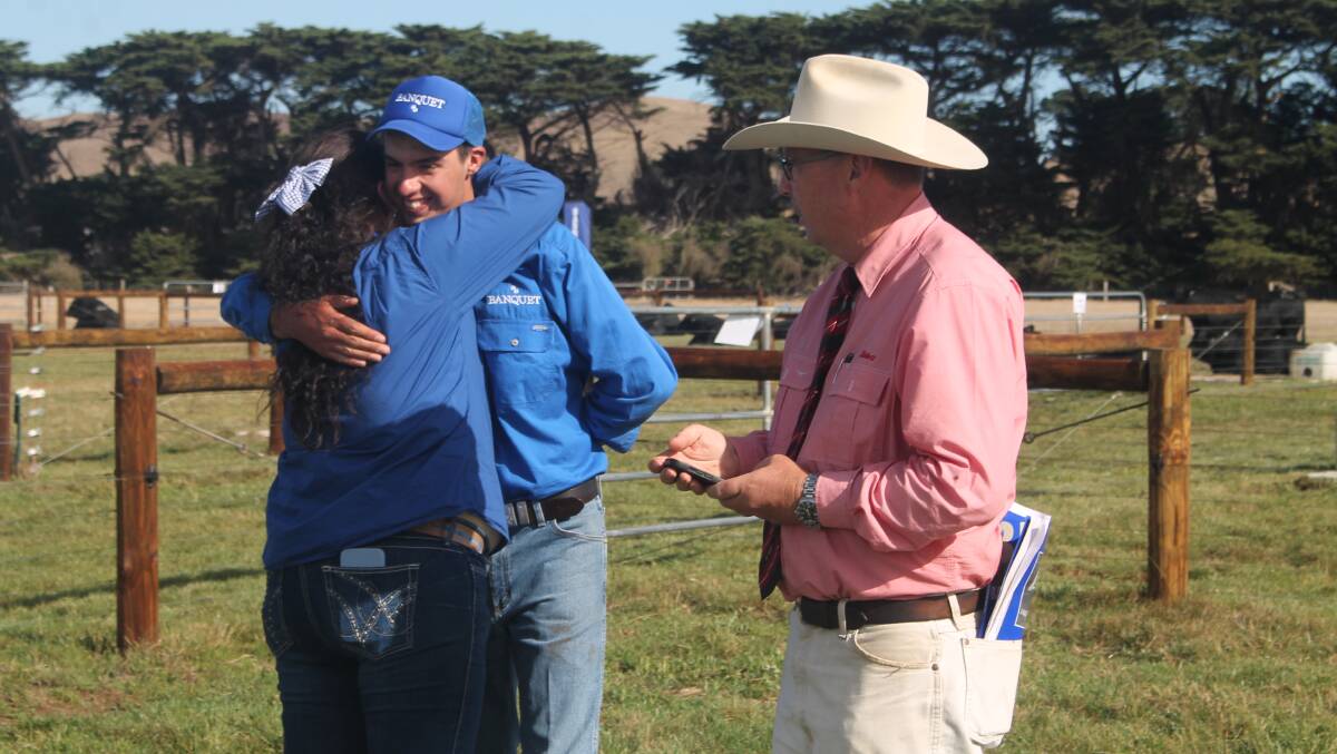 Dianna Meulendyks and Hamish Branson, Banquet, Mortlake, with Ross Milne, Elders, were overjoyed after the stud's bull sale. Picture by Philippe Perez