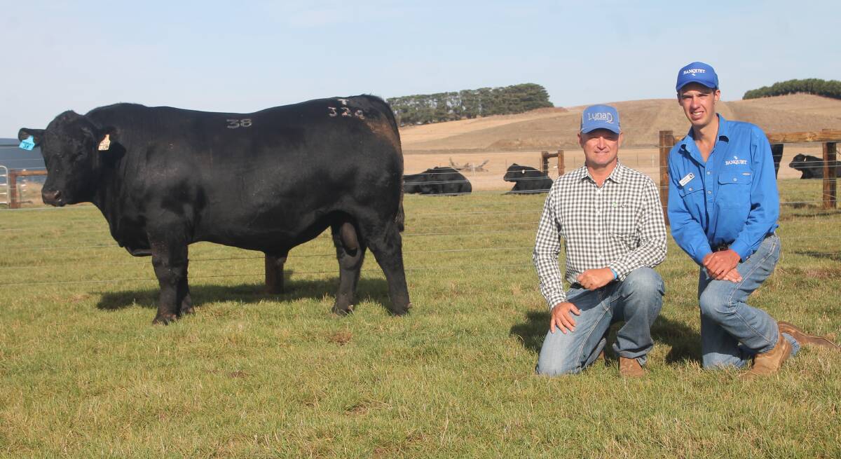 Brad Comiskey, Lunar Brangus and Ultra Blacks, Emerald, Qld, and Hamish Branson, Banquet, with the third-top-priced bull of the sale, Lot 38, Banquet Transferabull T324. Picture by Philippe Perez
