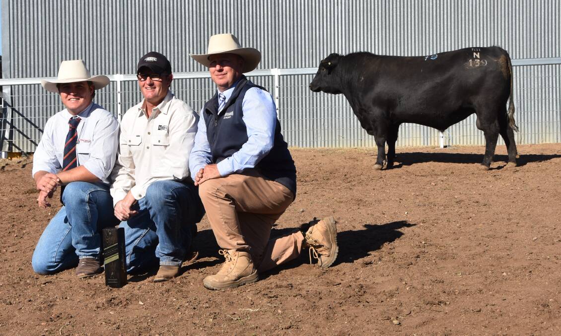 Booroomooka Nicconi N139 the first $14,000 top price bull with auctioneer Tom Tanner, Davidson and Cameron, Purchaser Scott Myers, Myanga Angus manager, Chatsbury and Booroomooka stud principal Sinclair Munro