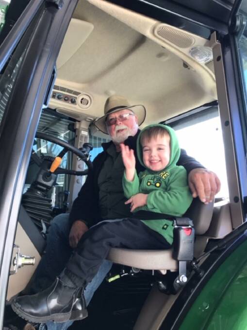 NEXT GENERATION: Bill Munton in the tractor with his grandson Dallas Osborn, who is a fifth generation farmer at Pittnacree in the Hunter Valley.