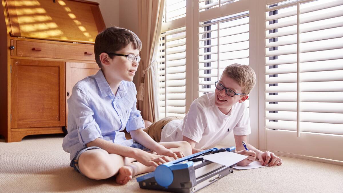 Family achievers: Joshua with his older brother Ben, whose encouragement and support is helping Joshua overcome the challenges of his vision impairment.