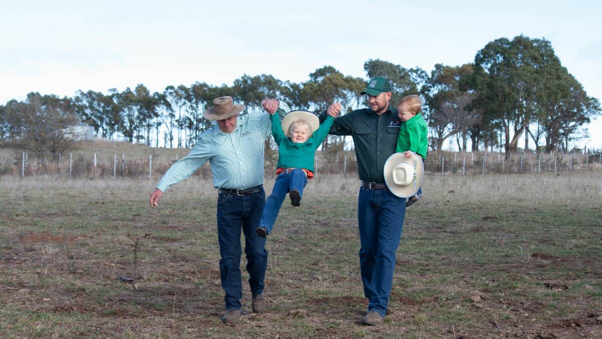 Family history: Father and son cattle breeders Eric and Laiton Turnham with the next generation, Dustin and Cooper.