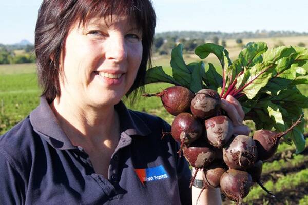 Narelle West at home on the farm in the Fassifern Valley near Kalbar, with some of the beetroot used in Kent's Produce products. 