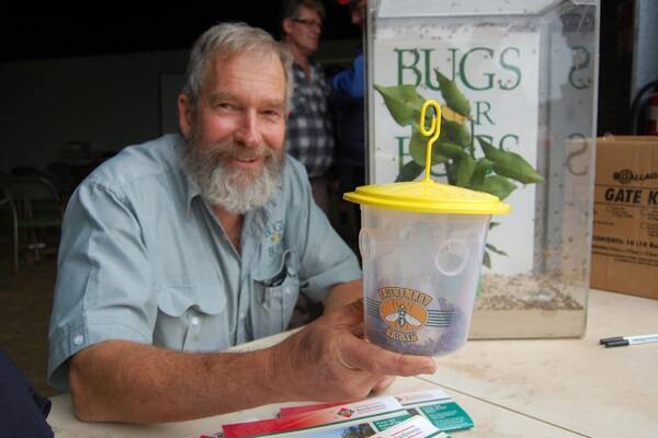 Bugs For Bugs entomologist Dan Papacek with a fruit fly trap which he said is one of the vital tools for monitoring and control using a systems approach. Picture: QCL File