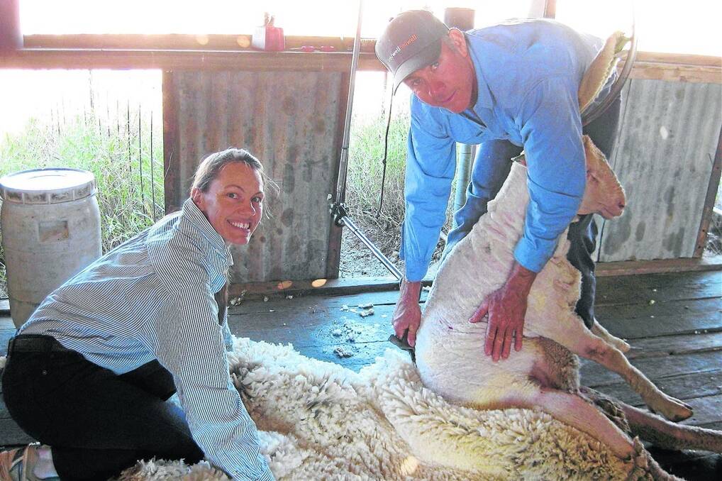 Jodi and Shane Axford during one of their favourite times on the farm, ram shearing day.