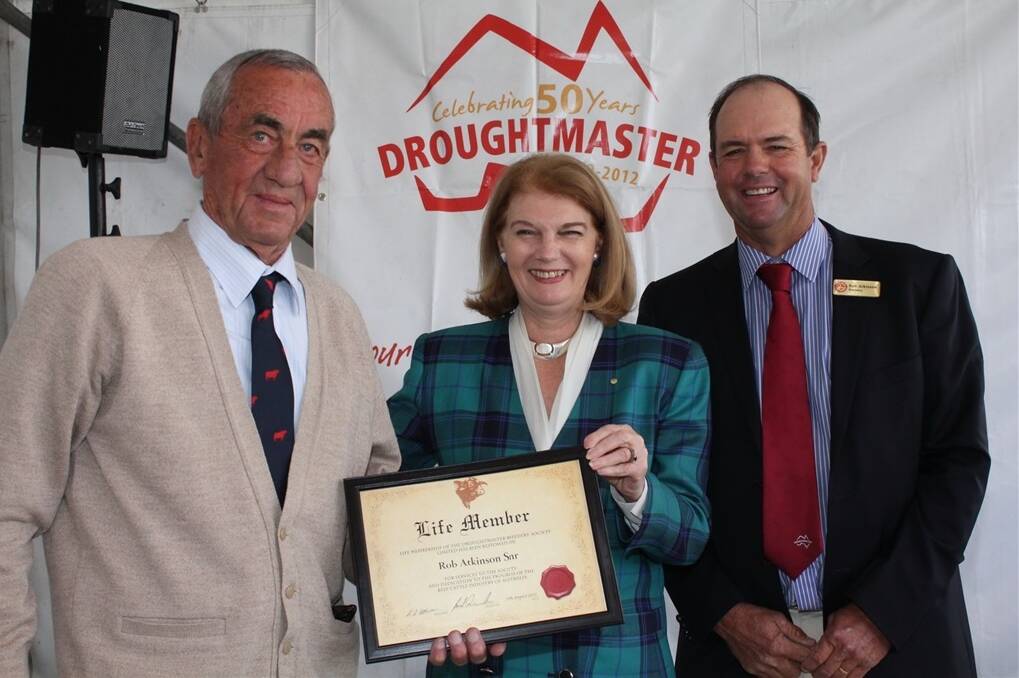 The late Rob Atkinson (Senior) was awarded life membership by the Droughtmaster Stud Breeders Association in 2012, and is pictured with the Governor of Queensland, Her Excellency Penelope Wensley, and son Rob Atkinson, Katandra, Hughenden.