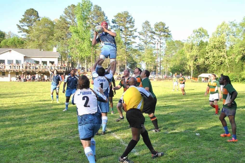 Queensland Outback Barbarians flanker Simon Lane (St George) goes high against Charlotte, North Carolina.