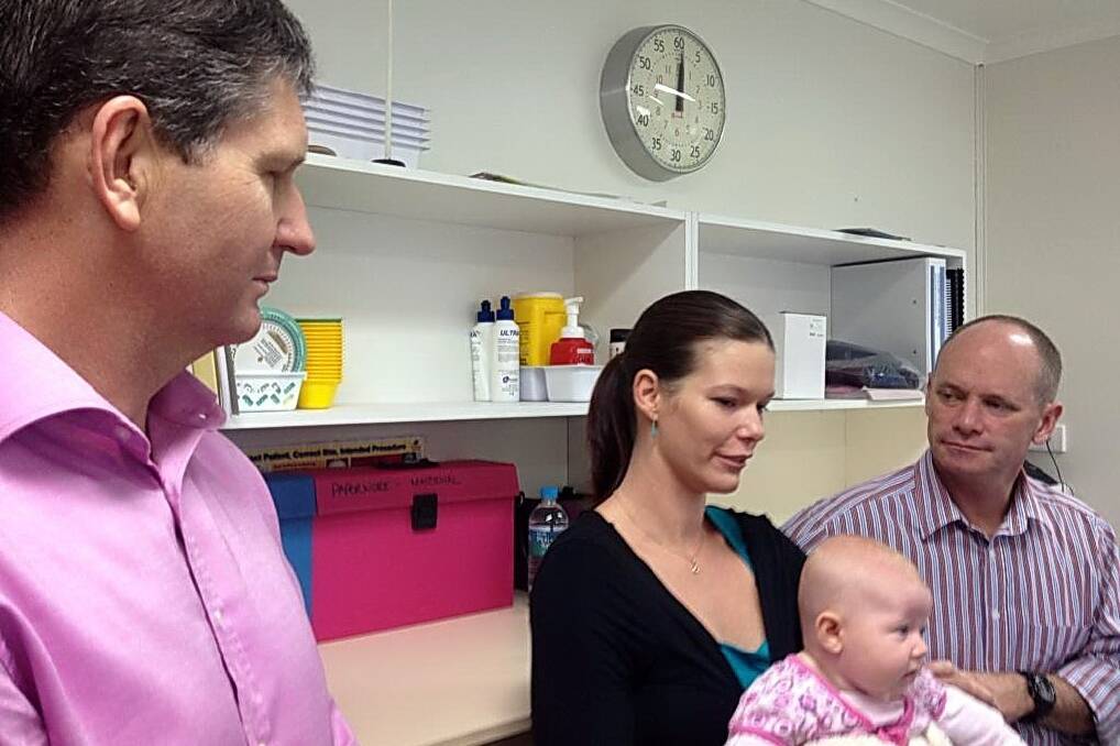 Health Minister Lawrence Springborg and Premier Campbell Newman chat with Telia Winton and her daughter Zoe, from Cooktown. Mrs Winton travelled from Cooktown to Mareeba to have Zoe but welcomes the prospect of having a future baby locally.