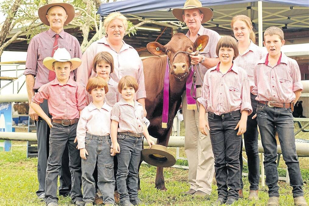 Eachamvale Illawarras won the inaugural triple crown for the most coveted dairy cow from the Cairns, Malanda and Atherton shows last year. Bronwyn and Greg English and their children Rachel, 14, Jerry, 13, Catherine, 11, Patrick, 10, Hannah, 8, and twins Mary and Frances, 5 are pictured with judge Baden Teese, Beaudesert, Qld.