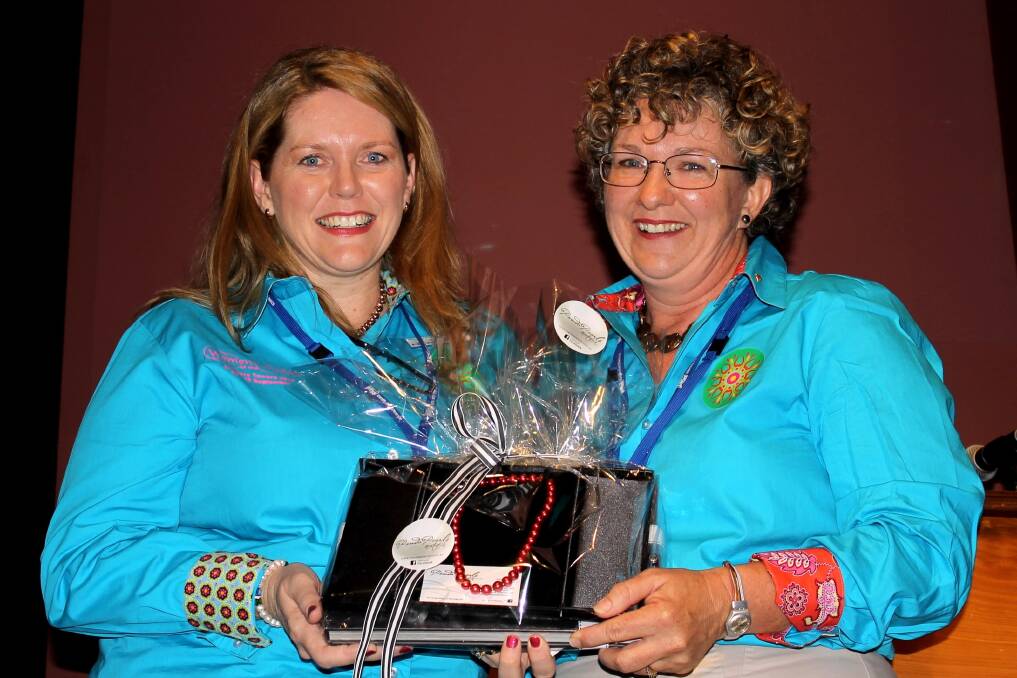 Incoming QRRRWN president Alison Mobbs presented Georgie Somerset with honorary life membership at the 2014 conference.