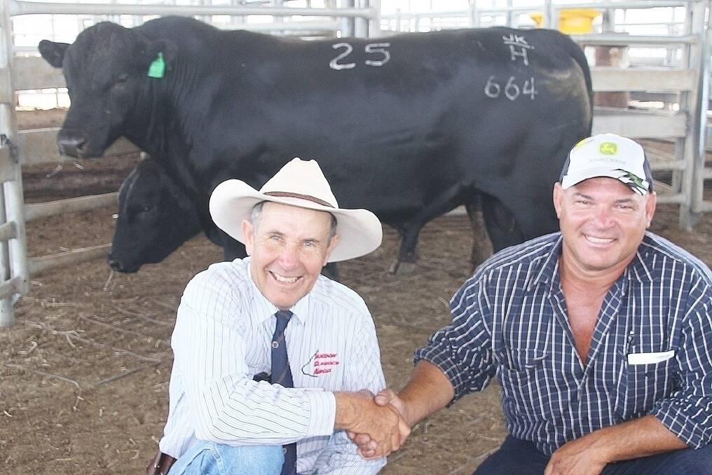 The inaugural Emerald sale of the Sandon Glenoch Angus stud topped at $7000 four times. Stud principal, Roger Boshammer (right) congratulates one of his top priced buyers, Shane Griffin, Koumala.