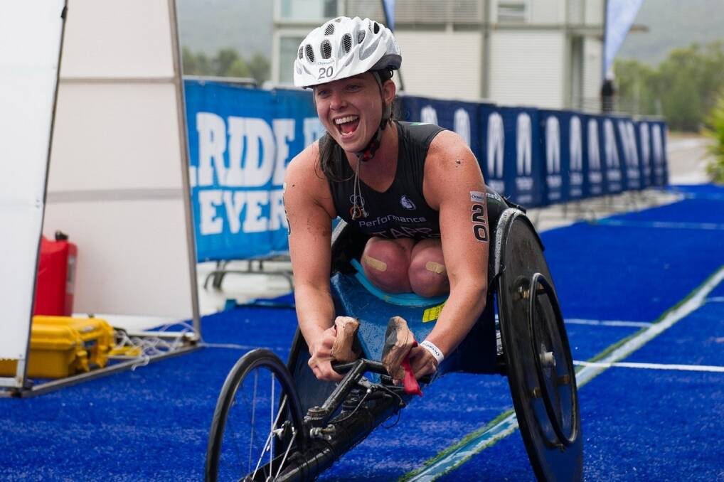 Emily Tapp crossing the finish line to claim her first para-triathlon title. Picture: KEITH HEDGELAND PHOTOGRAPHY.