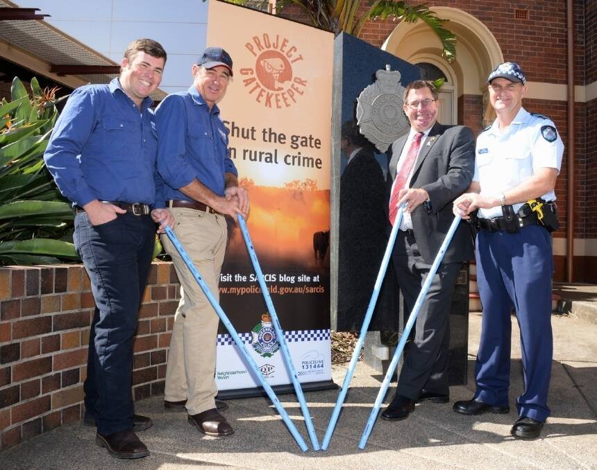 Jonny and Bruce Arkins, Genomix, Greenmount, with SARCIS state coordinator, Mick Dowie, Brisbane, and Queensland Police sergeant Scott McGrath, Toowoomba, with the blue drafting 'waddies' that will be available at Beef Australia 2015 next week. <i>- Picture: SARAH COULTON.</i>