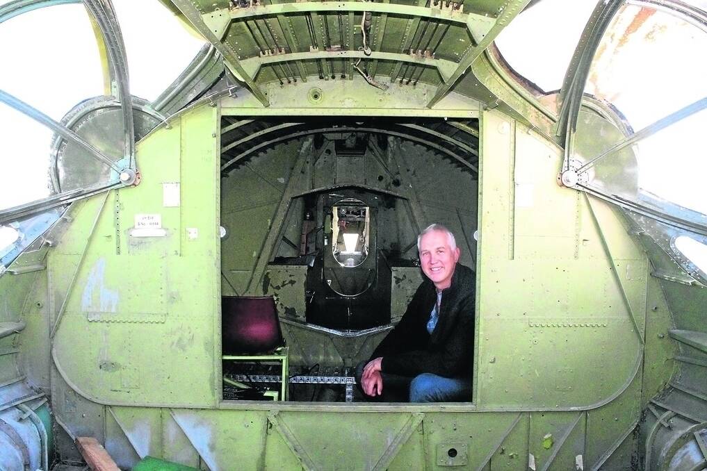 Qantas Founders Outback Museum CEO Tony Martin inside the fuselage of the Catalina flying boat, the latest addition to the display of iconic planes in the museum's collection in Longreach.