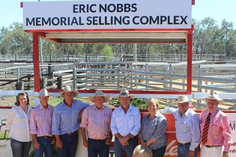 Selling under the new Eric Nobbs Memorial Selling Complex are its namesake's family: Olivia McDouall, Phillip, Tom, Chas, Roger, Linda and Stewart with Tom Cuskelly, Elders, Moura.