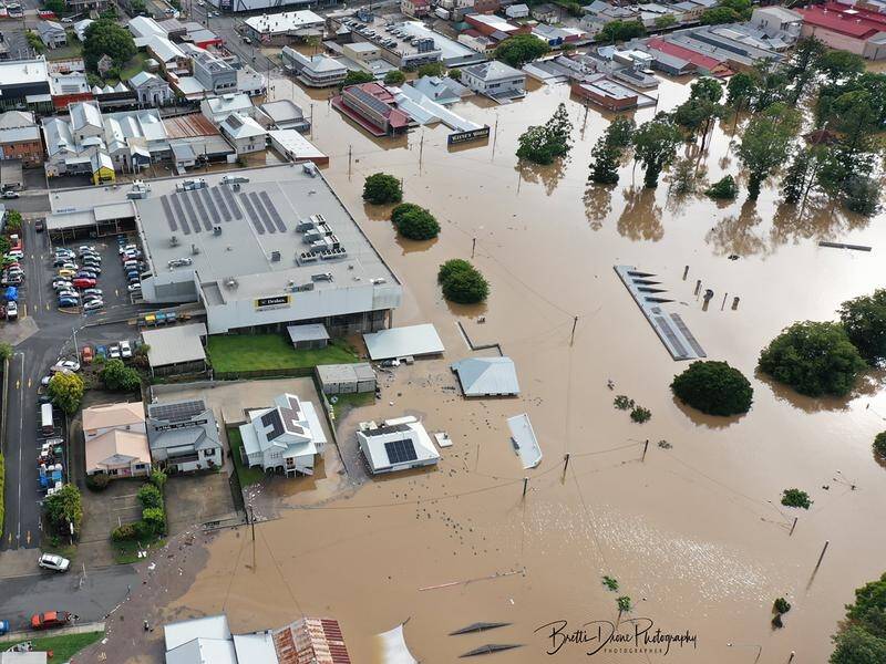 Six people have died in Queensland floods, with a search under way for a missing yachtsman.