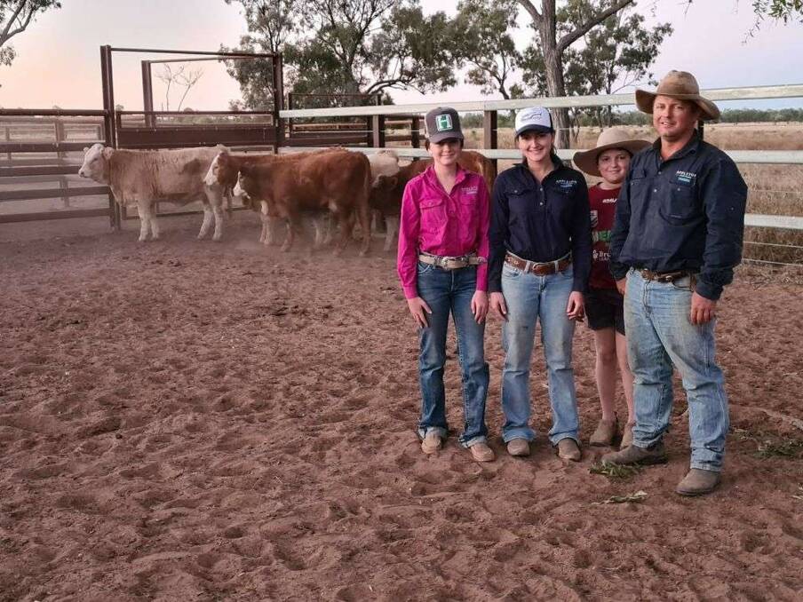 LIVING THE GOOD LIFE: Izabelle, Charlize and Lochie Appleton help out their dad Loid in the yards. The Appleton family runs 13,000 breeders on a number of properties in the Belyando River and Hughenden regions.