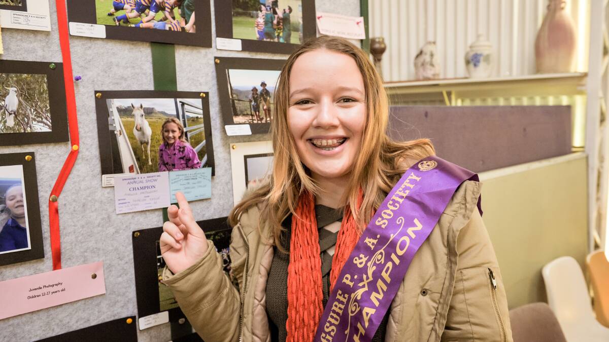 WINNER WINNER: Shaelee Taylor, 14, with her champion photo at the Springsure Show. 