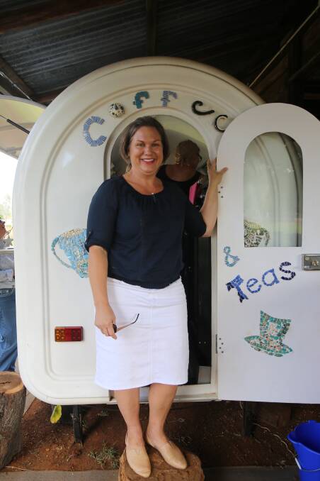 Alexandra York stands at the side of the Rolleston Coffee Cart in the Park. 
