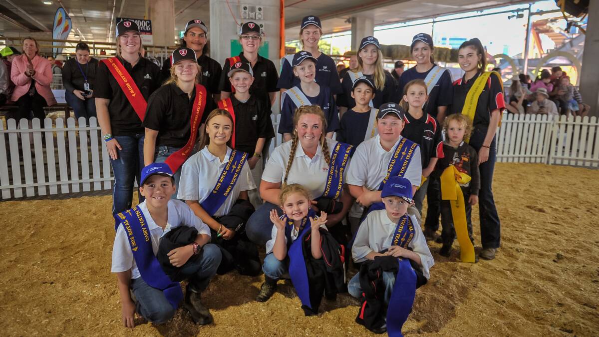 The winners of the Stan Paulger Memorial Dairy Youth Challenge kneel in front of their fellow competitors. 