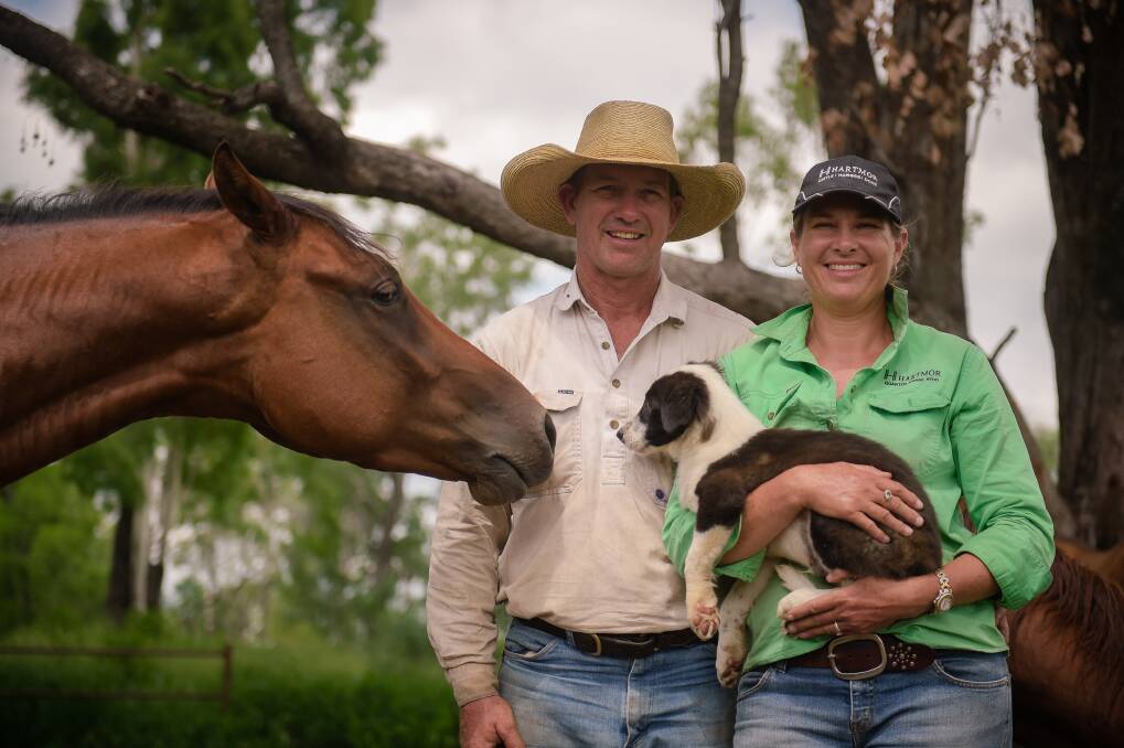 Scott and Michelle Hartwig at home at Goolara Siding, Theodore. Mrs Hartwig said the busy operation was “just trying to do more of the same while the cattle prices are there". Photo - Kelly Butterworth. 