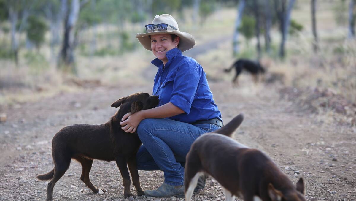 Melissa with two of her dogs on the family's property Mayfield, near Bogantungan.