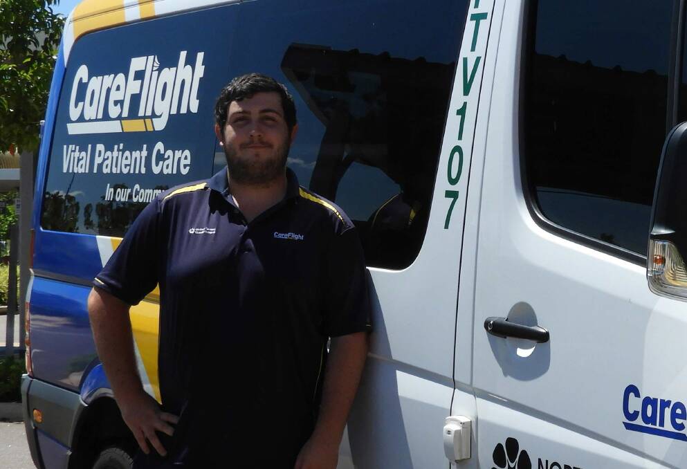 Tom Cluff in front of his CareFlight patient transport van.