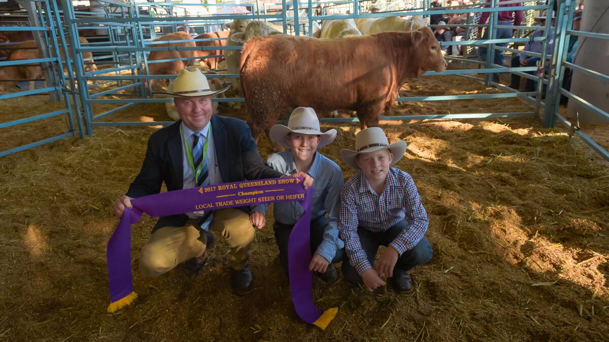 Broad ribbon: Darren Perkins, George and Forman, and his sons Harrison and Blake, representing Brodie and Vicki Budd, Wandoan, with their champion trade weight steer.