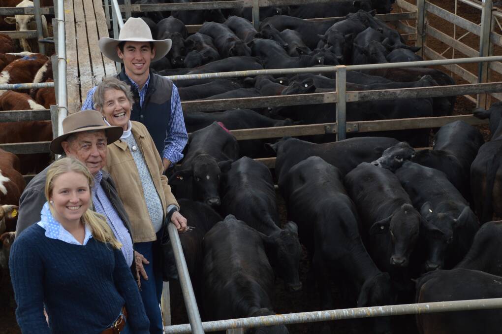 Top job: Belinda McLean, St George, Ian and Joy Macallister and Ben Whip, Roma Downs, Roma, offered 313 Angus and Angus Brangus cross steers at today's Roma store sale.