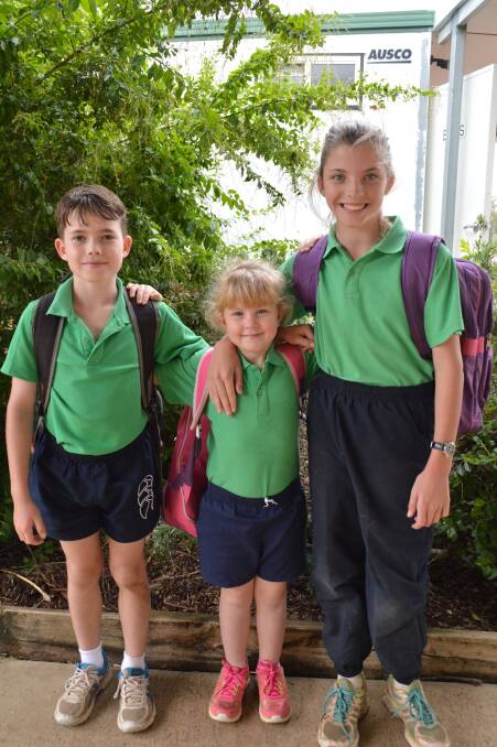 Bags packed: Harry McMillan, 9, Brooke Harvey, 5, and Peggy Henning, 11, were ready and raring for a fun filled day at Teelba State School.