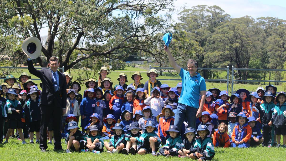 Downlands College deputy principal Tim Morrison and AgForce CEO, Michael Guerin, with school children at the final Moo Baa Munch event in October 2018, which has been axed after funding was pulled from the SIPP. Photo - Helen Walker.