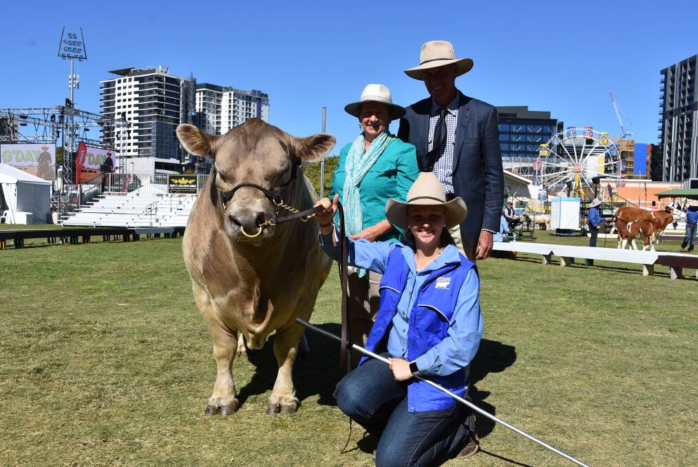 Grand champion bull: Oakvale Man O Man, with owners Gary and Heather Sewell, Wondai and handler Shyane Yates.