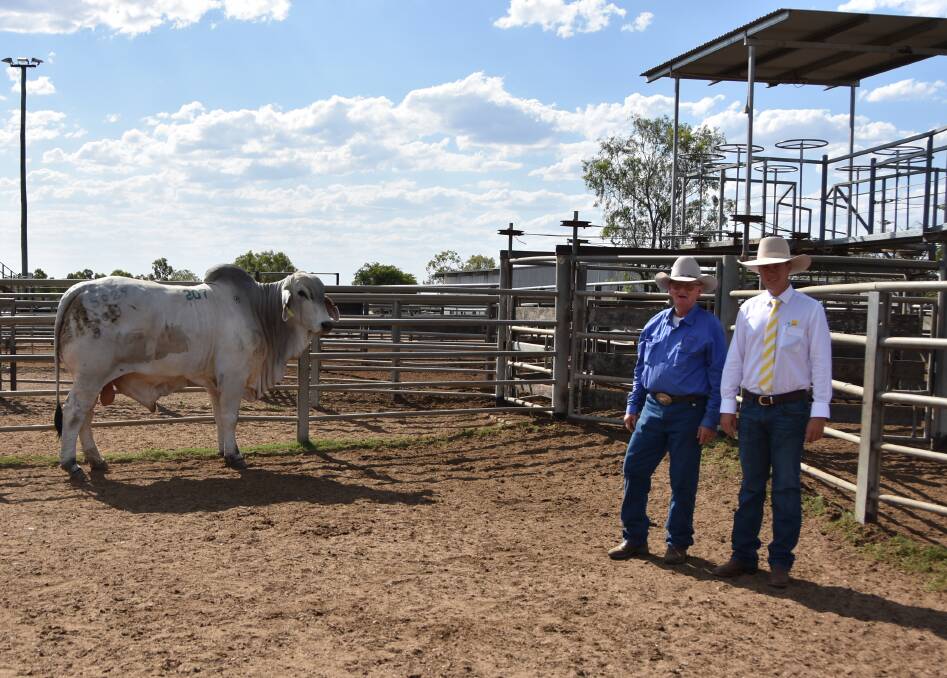 Vendor Kelvin Maloney, with Kenilworth 5929 (PS), which sold for $26,000, and Ray White agent Liam Kirkwood.
