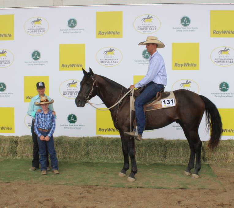 Top price stallion: Belinda, Riley and Craig Ellrott with Big House Matlock who sold for $21,000 Peter and Melissa Hill, Clarke Creek. Picture: Helen Walker. 