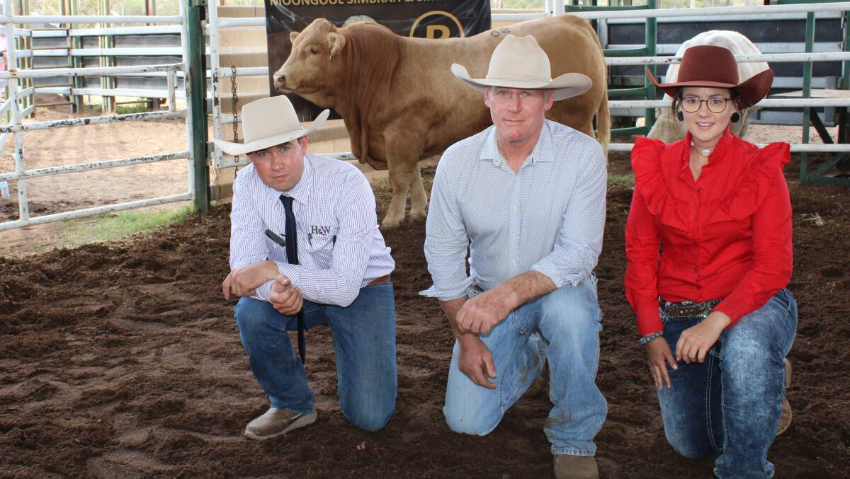 Top price Charolais bull Moongool MR Q551 (P) who sold for $48,000 is pictured with auctioneer Jake Passfield, Hoch and Wilkinson, Clermont, co-principal Ivan Price and buyers representative Amy Whitechurch, Fourways Charolais Stud, Inverell, NSW.
