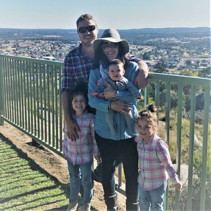 Edwina and Adam McVeigh with their three children. 