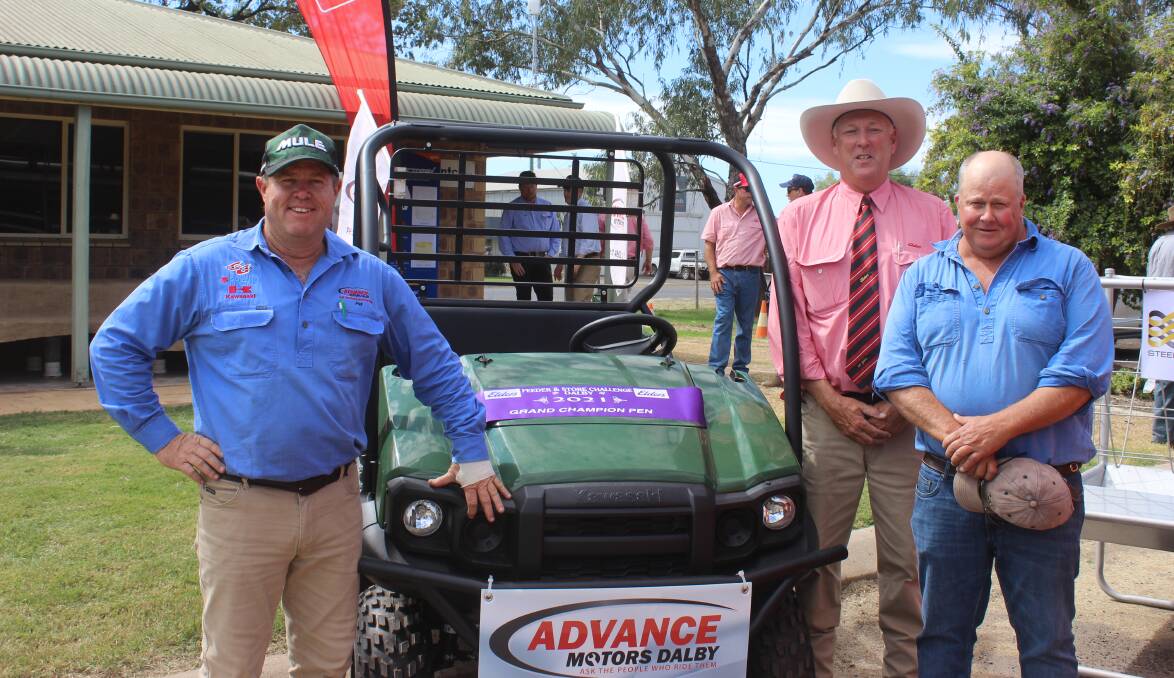 Pat Walsh, Advance Motors, Dalby and Ashley Loveday, Elders manager Dalby, congratulate the winner of the champion pen of steers Craig Brimblecombe, Boningar Pastoral Co, Meandarra. Pictures: Helen Walker